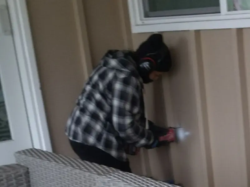 Professional electrician installing an exterior outlet in Connoquenessing